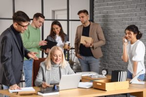 A product team reviews an accessibility dashboard that highlights AI in accessibility remediation across a large library of digital learning content.