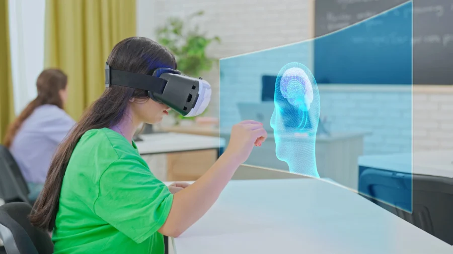 A student wearing a VR headset and interacting with a 3D brain model in a classroom setting, highlighting interactive educational simulations for immersive learning in STEM education.